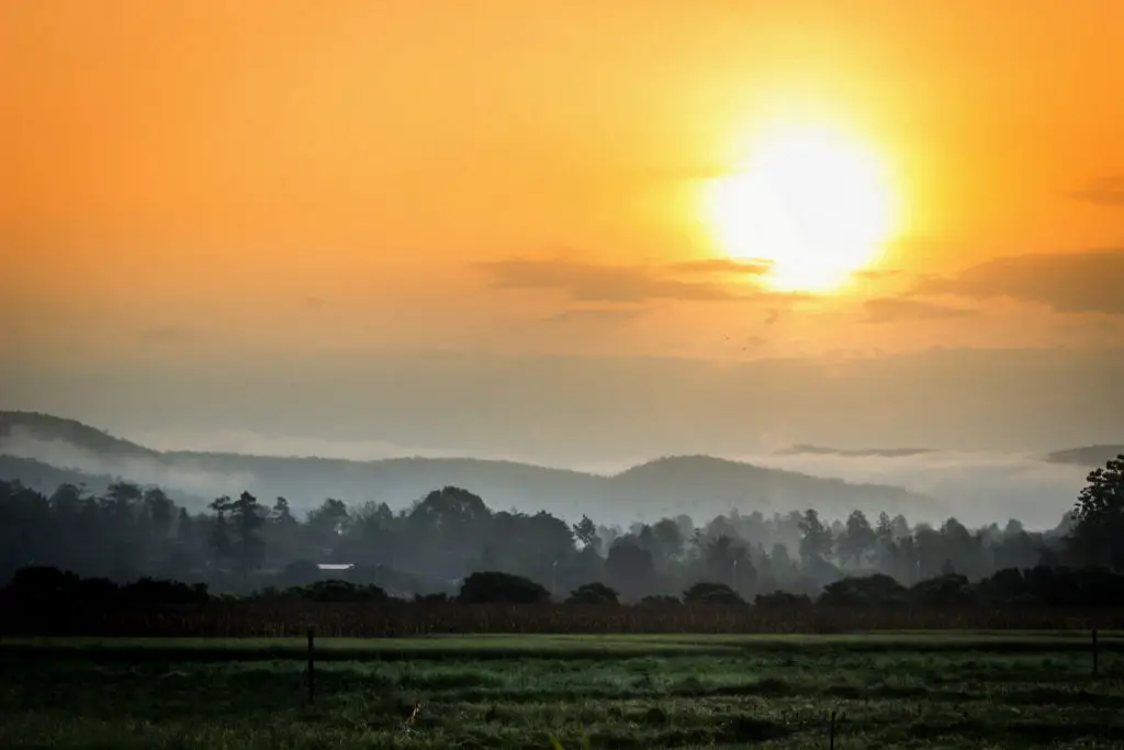 sun rising over forests in North Thailand