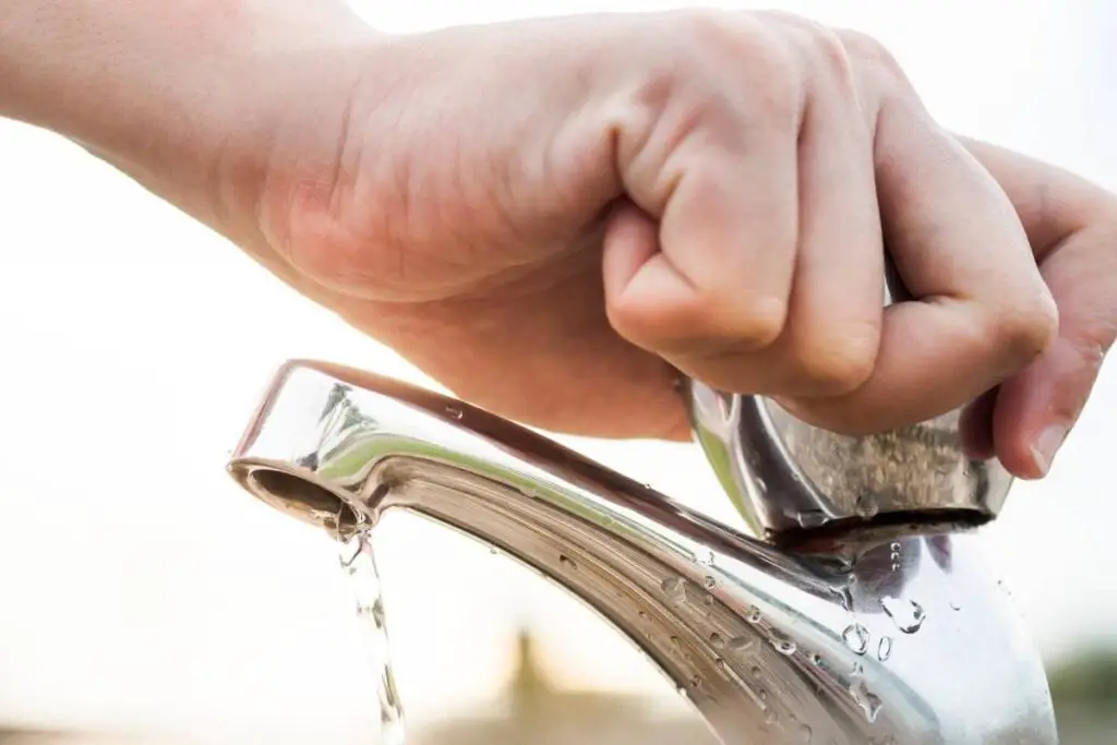 closing the faucet to save water