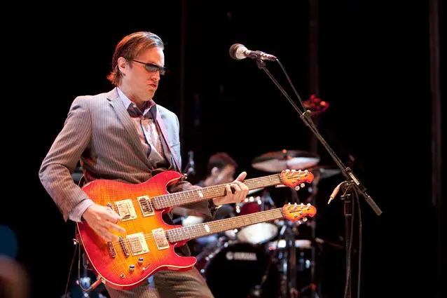 man playing double kneck guitar