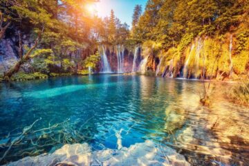 Majestic view on turquoise water and sunny beams in the plitvice lakes national park, croatia