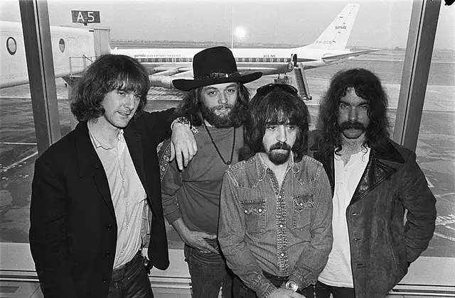 Group photo of The Byrds in airport lounge