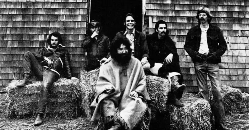 Grateful Dead rock band posing like a bunch of hippies on straw bales