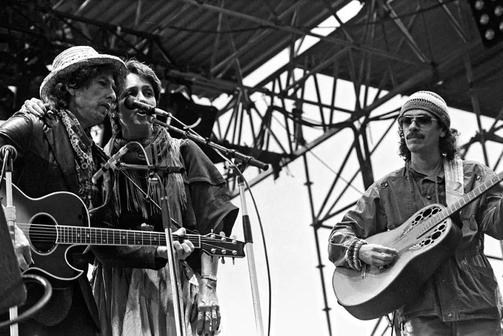 woodstock music festival Dylan, Baez and Santana on stage playing