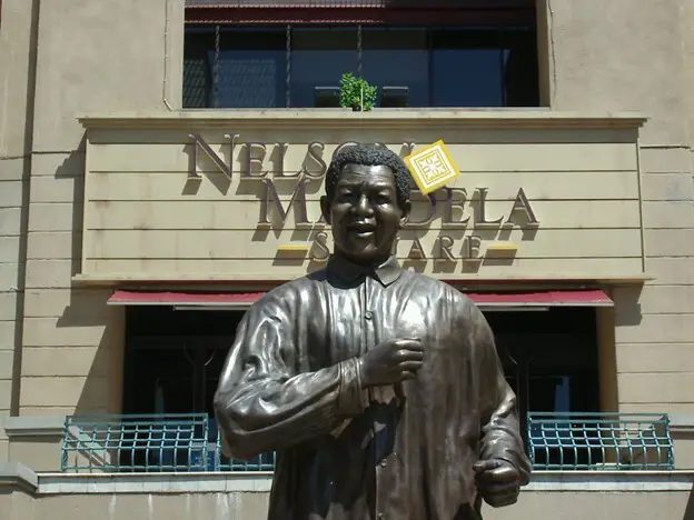 The statue of Nelson Mandela located in Nelson Mandela Square in Sandton, South Africa.
"Statue of Nelson Mandela 1" by Paul Jacobson
