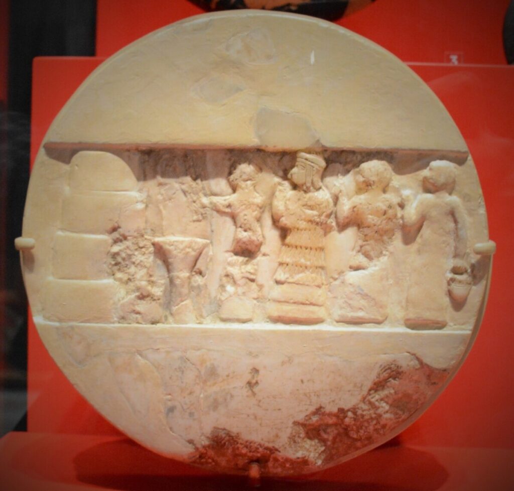 This ancient disk, called The Disk of Enheduanna, includes a depiction of the priestess in the centre. "File:Disk of Enheduanna (2).jpg" by Zunkir 