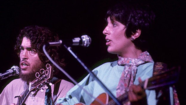 Joan Baez photographed on stage at Woodstock '69 - https://swamisatchidananda.org/life/woodstock-guru/