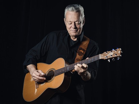 Tommy Emmanuel playing acoustic guitar - https://guitar.com/features/interviews/tommy-emmanuel-new-album-the-best-of-tommysongs/