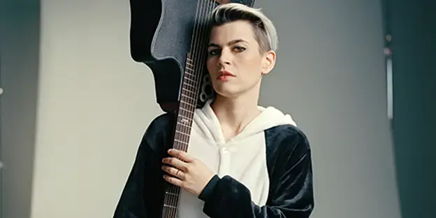 Kaki King holding acoustic guitar over her shoulderhttps://www.premierguitar.com/artists/kaki-king-my-stamina-and-accuracy-have-gone-to-shit