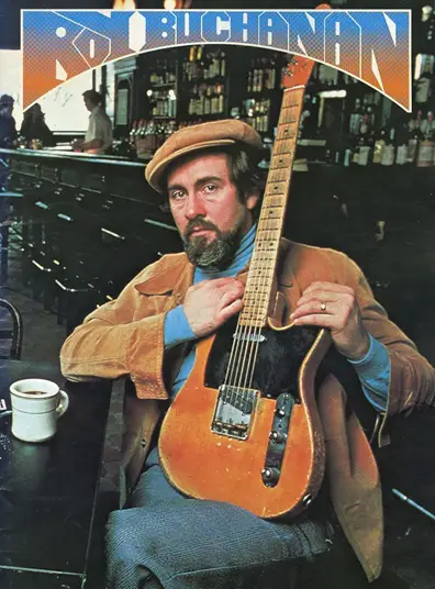 Photo of Roy Buchanan sitting in a pub with guitart and coffee - Image source: https://www.fuelrocks.com/roy-buchanan-the-innovative-american-guitarist/