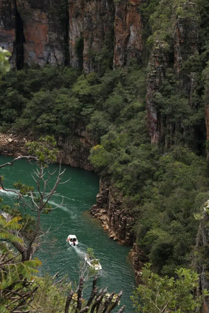 Boats travelling down a river canyon in Brazil