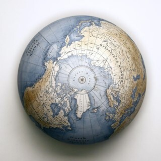 Photo of a globe looking down on the North Pole