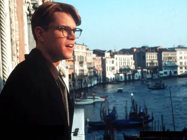 Looking over the balcony of a house by the sea, Matt Damon stars in what is considered the definitive film adaptation of The Talented Mr Ripley