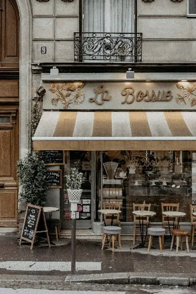 Photo: Camille Brodard/Unsplash. A Paris footpath and cafe