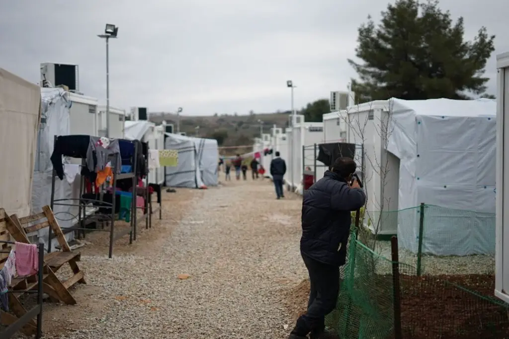 Photo: Julie Ricard/Unsplash. Refugee Camp.