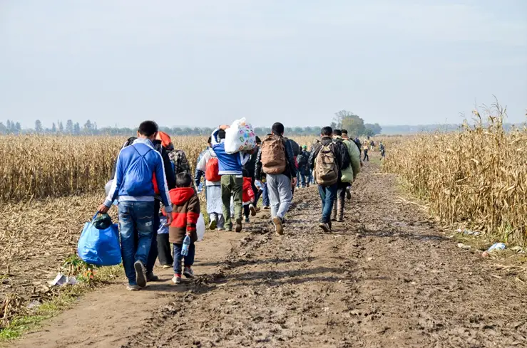 Photo: Ajdin Kamber/Shutterstock. Group of war refugees on the Border between Serbia and Croatia.