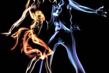 Orange and Blue computer generated depiction of a couple of Cha-Cha dancers on a black background