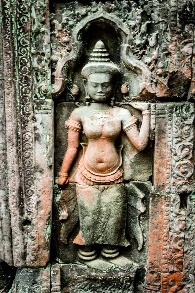 Khmer sculpture of a woman in the wall of a temple at Angkor
