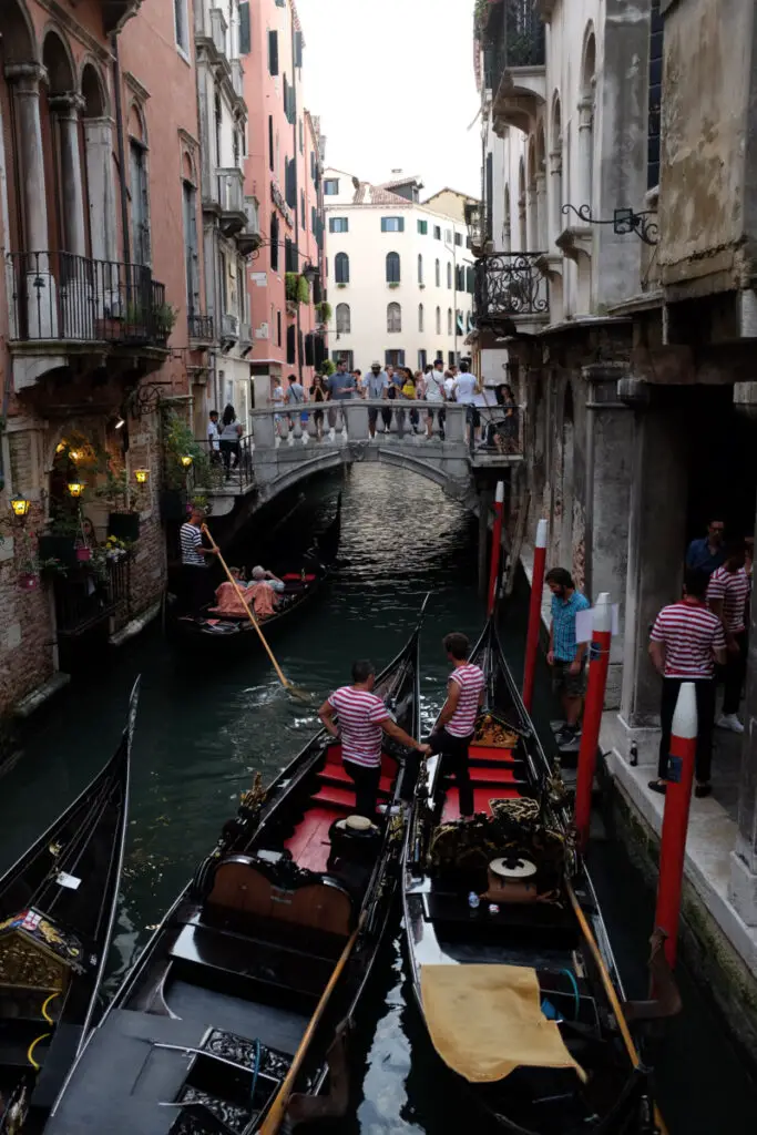 2 gondalas on a venetian canal