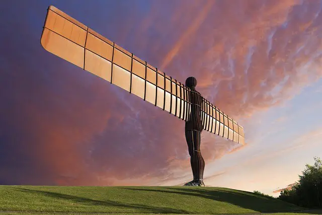 Huge statue of a man with rectangular wings